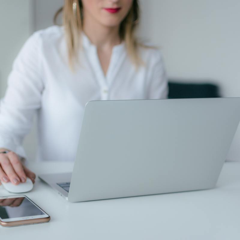 happy professional woman grabbing a paper